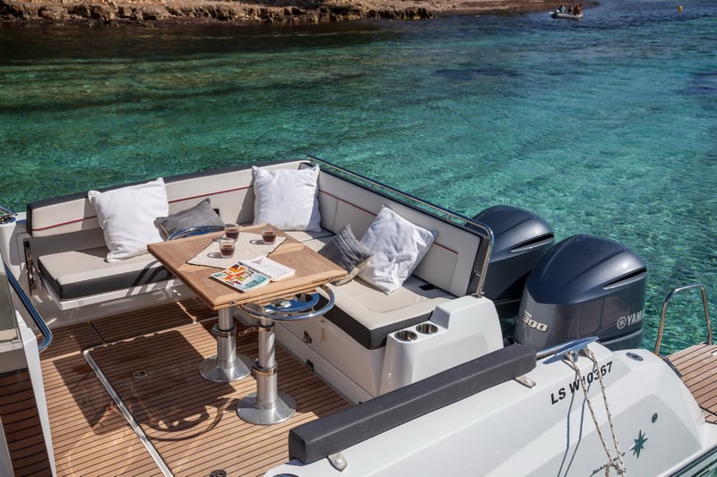 L-shaped aft seating area on Jeanneau Cap Camarat 10.5 WA
